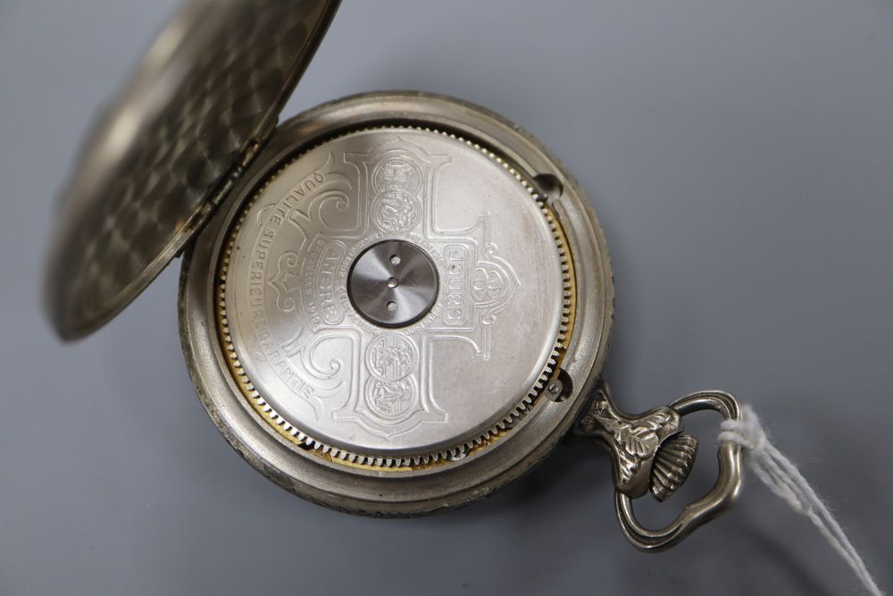 A mid 20th century base metal Hebdomas 8 Day pocket watch, the case back embossed with artist at work.
